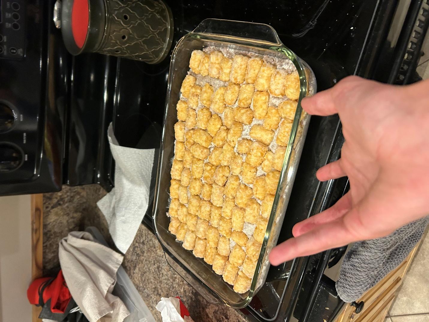 Arranging tater tots on top